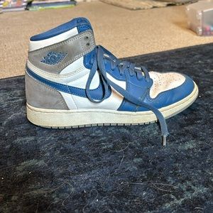 Im selling Jordan 1 true blues. They are Nikes. The shoes are blue,white, grey.